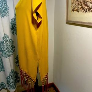 Golden yellow sleeveless tunic top w/fringe bottom.